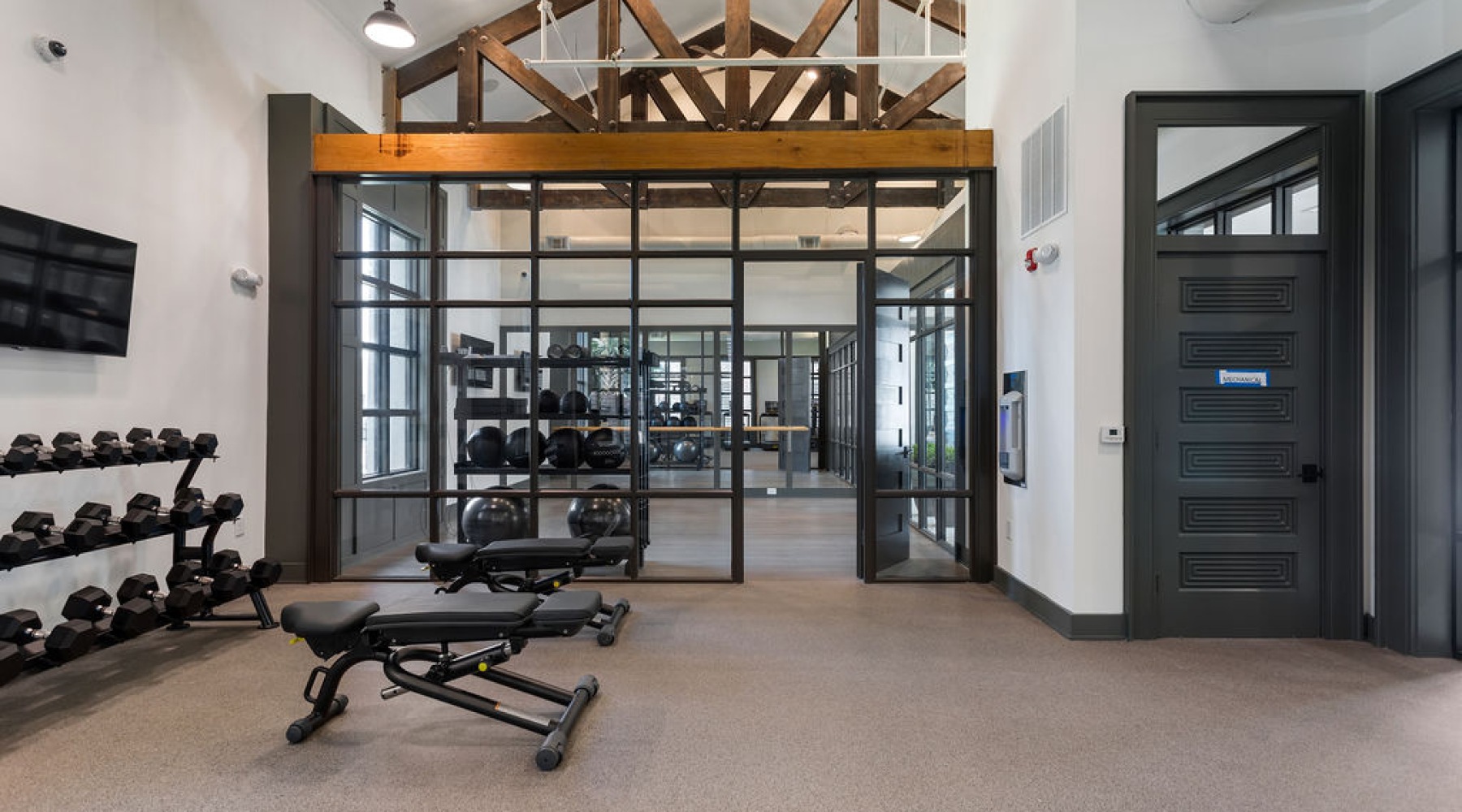 Fully equipped fitness center inside The Porter apartments in Charleston South Carolina.